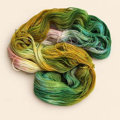 Open skein of Flip Flops a hand dyed yarn from toad Hollow yarns green yellow and pink variegated yarn