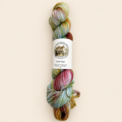 Kiss the Girls hand-dyed variegated yarn by Toad Hollow Yarns, blue with pink and green and orange