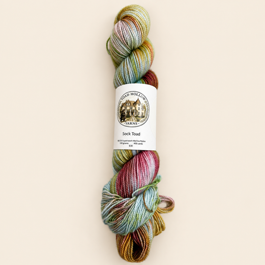Kiss the Girls hand-dyed variegated yarn by Toad Hollow Yarns, blue with pink and green and orange