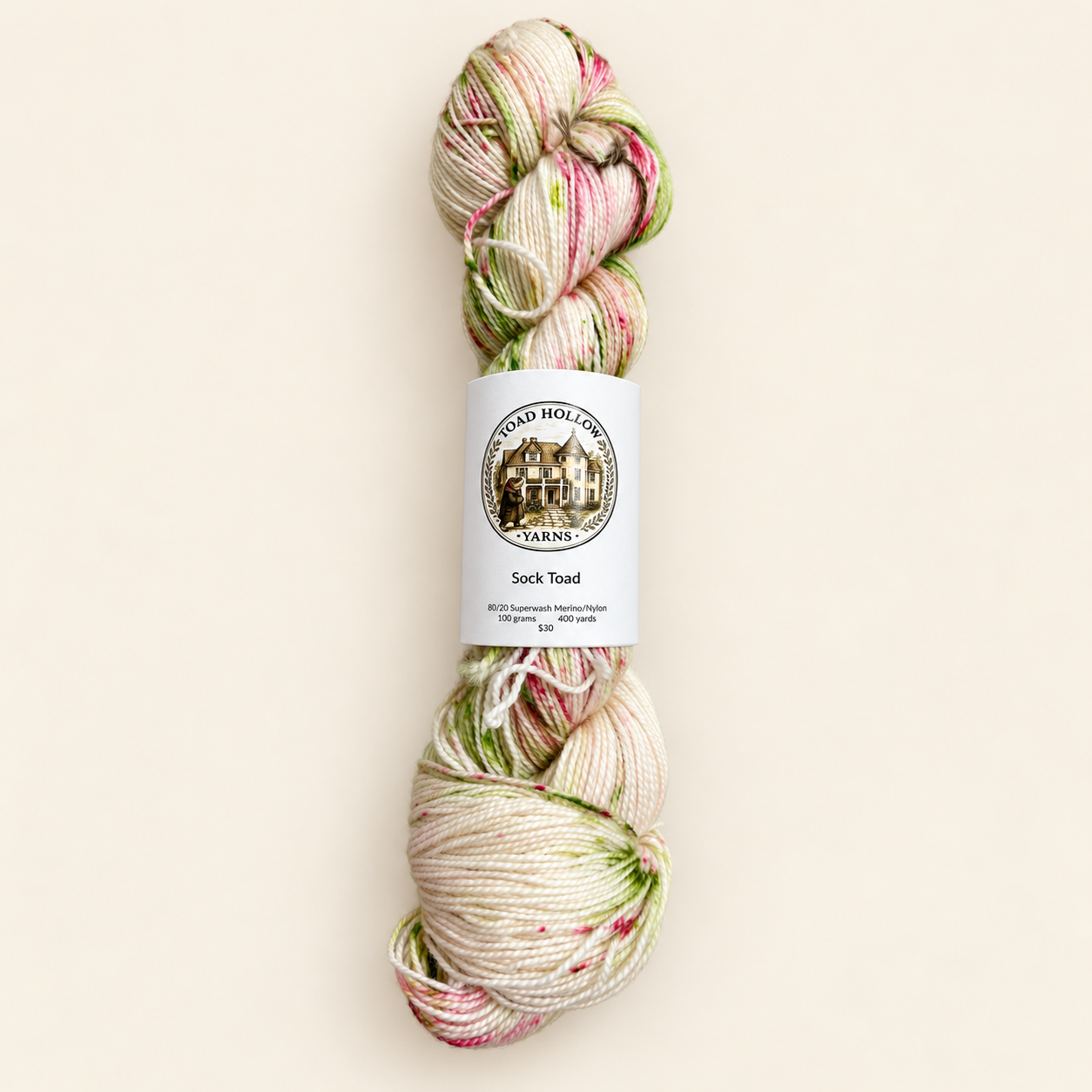 Speckled yarn from Toad Hollow Yarns, L’été is cream background with pink and green specks