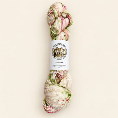 Speckled yarn from Toad Hollow Yarns, L’été is cream background with pink and green specks