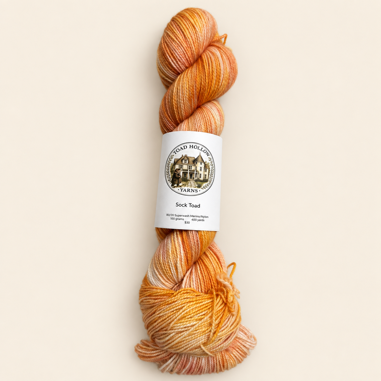 product photo of one skein of Umbrella Drinks a bright orange variegated hand dyed yarn from toad hollow.  Main color is orange with a peachy pink undertone