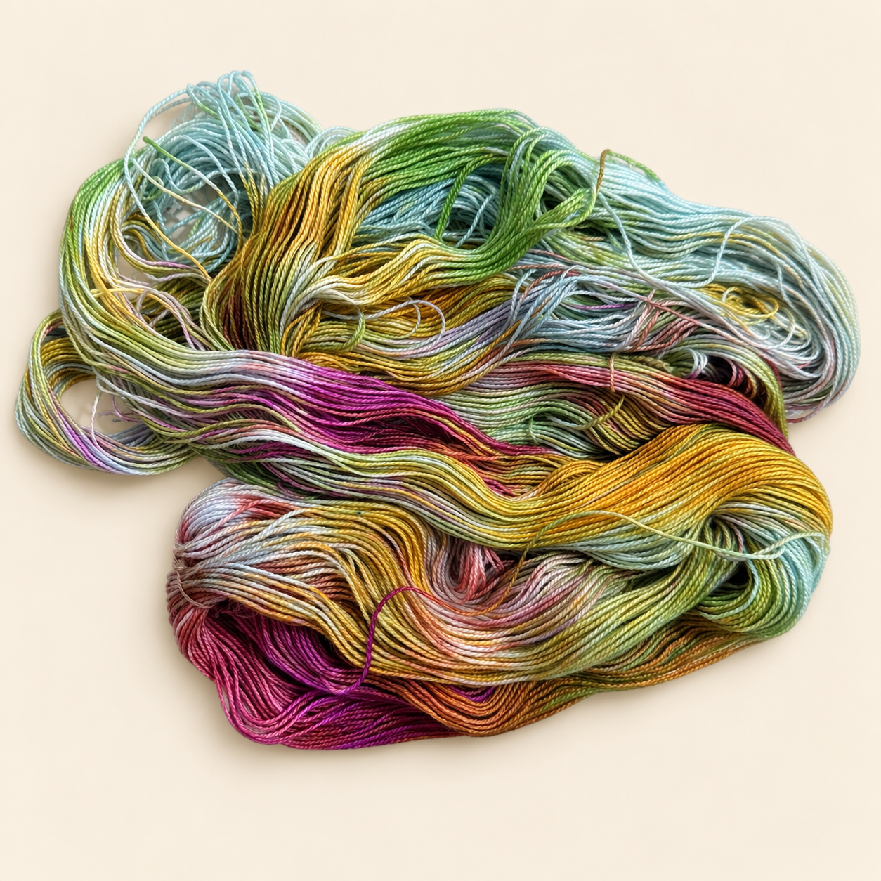 Kiss the Girls variegated yarn by Toad Hollow Yarns featuring blue, green, orange and pink